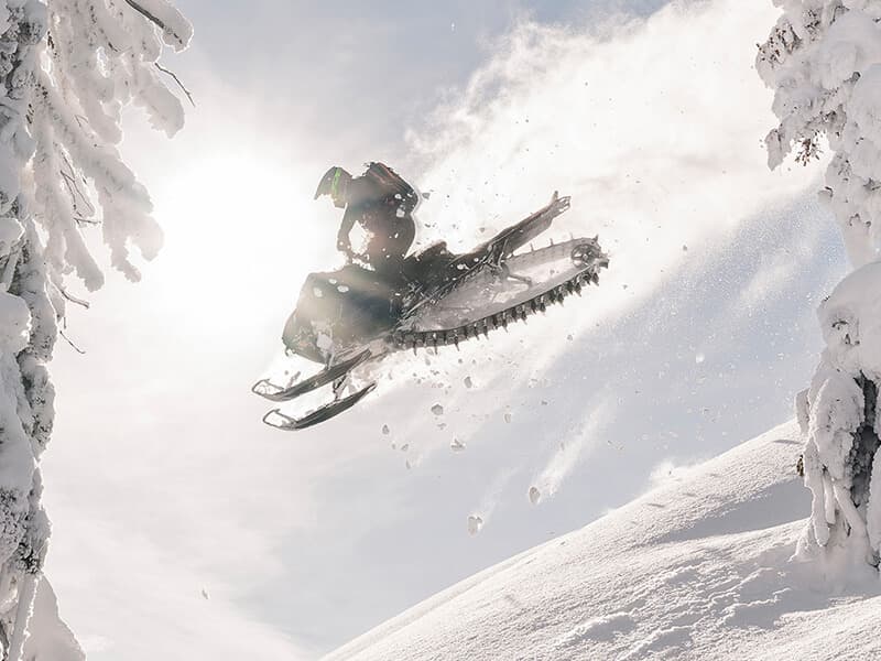 Arctic Cat snowmobile carving deep powder